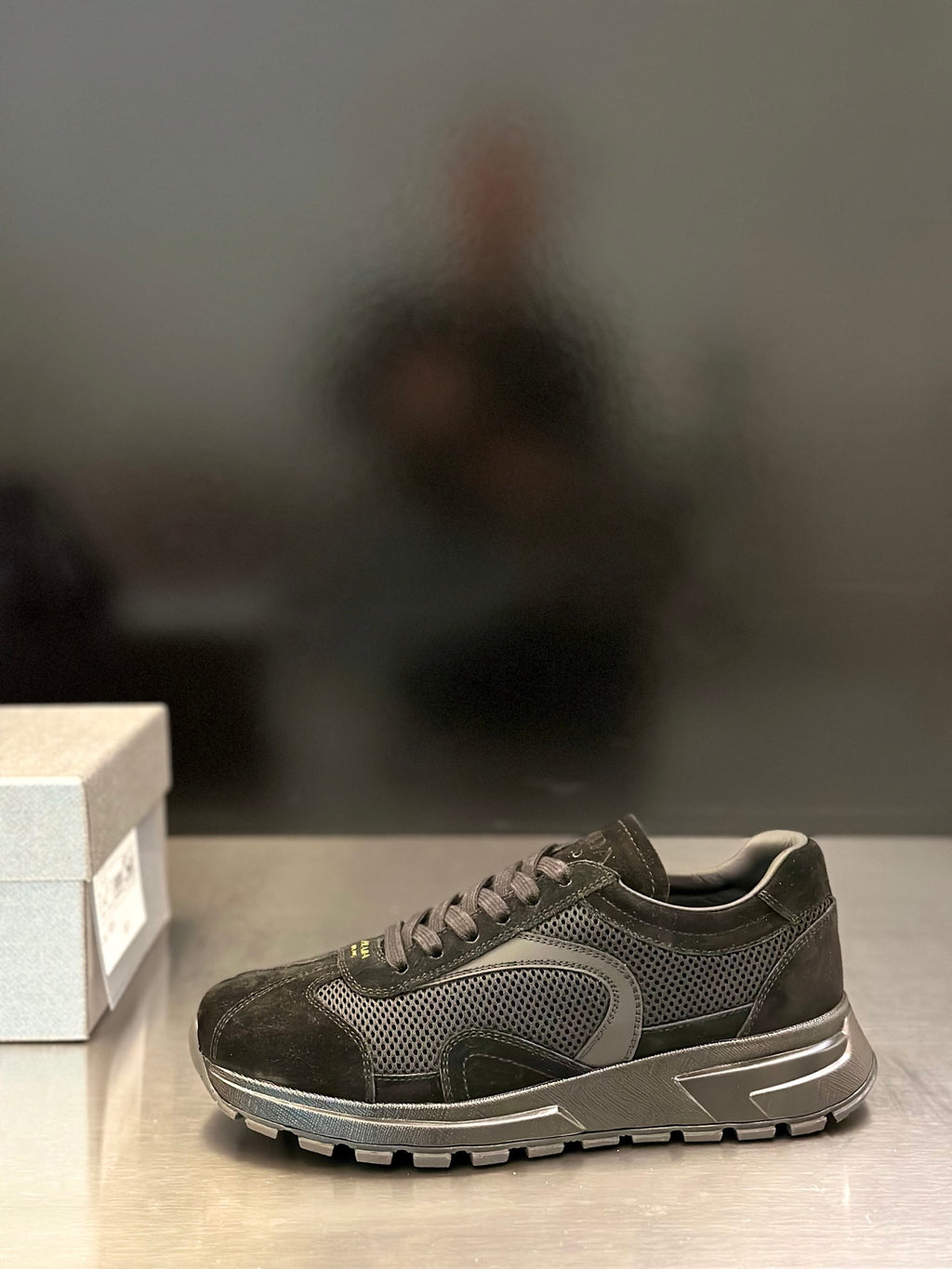 Prada unisex sneaker with mesh upper, suede overlays, and lace-up closure