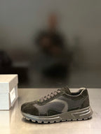 Prada unisex sneaker with mesh upper, suede overlays, and lace-up closure