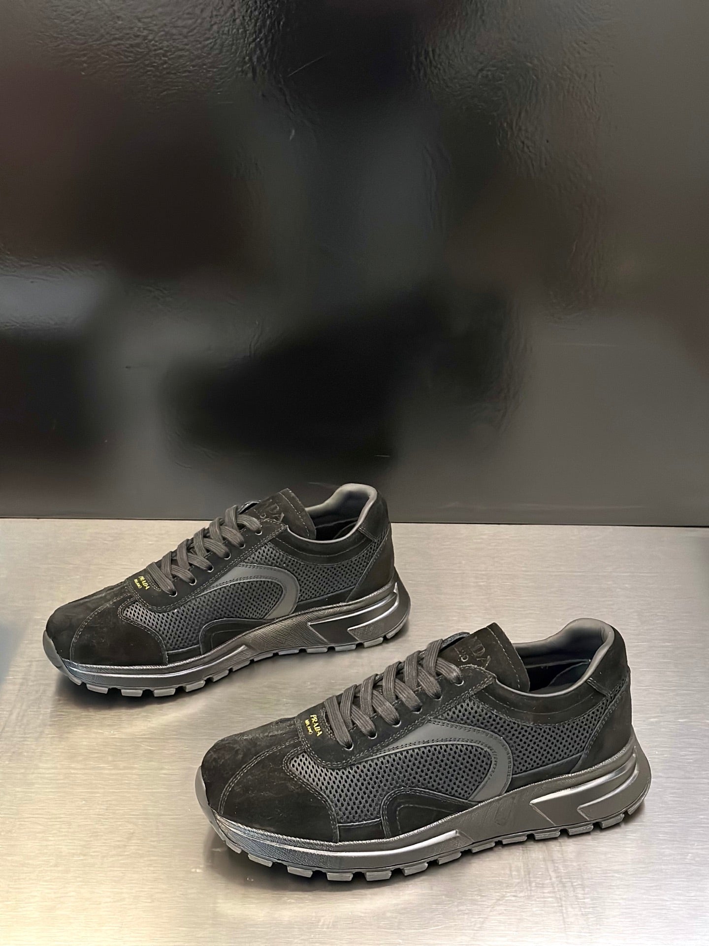 Prada unisex dark suede sneakers with lace-up front and padded collar