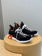 Hermes unisex sneakers, black with orange collar, white laces, white ribbed midsole