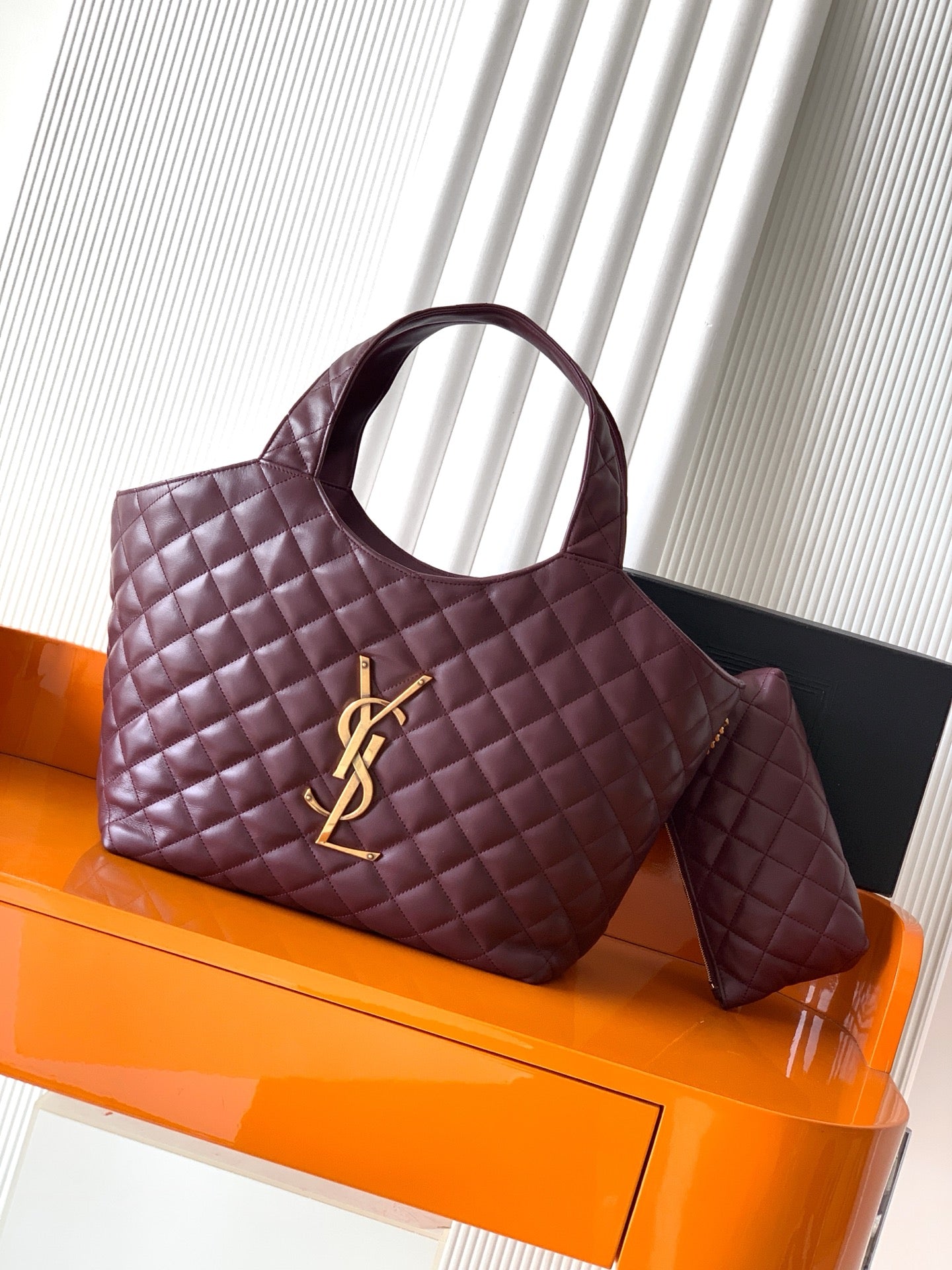 YSL quilted tote bag with top handles, burgundy leather, gold logo accent