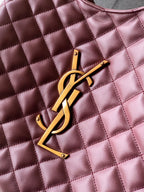 YSL gold logo emblem on quilted burgundy leather