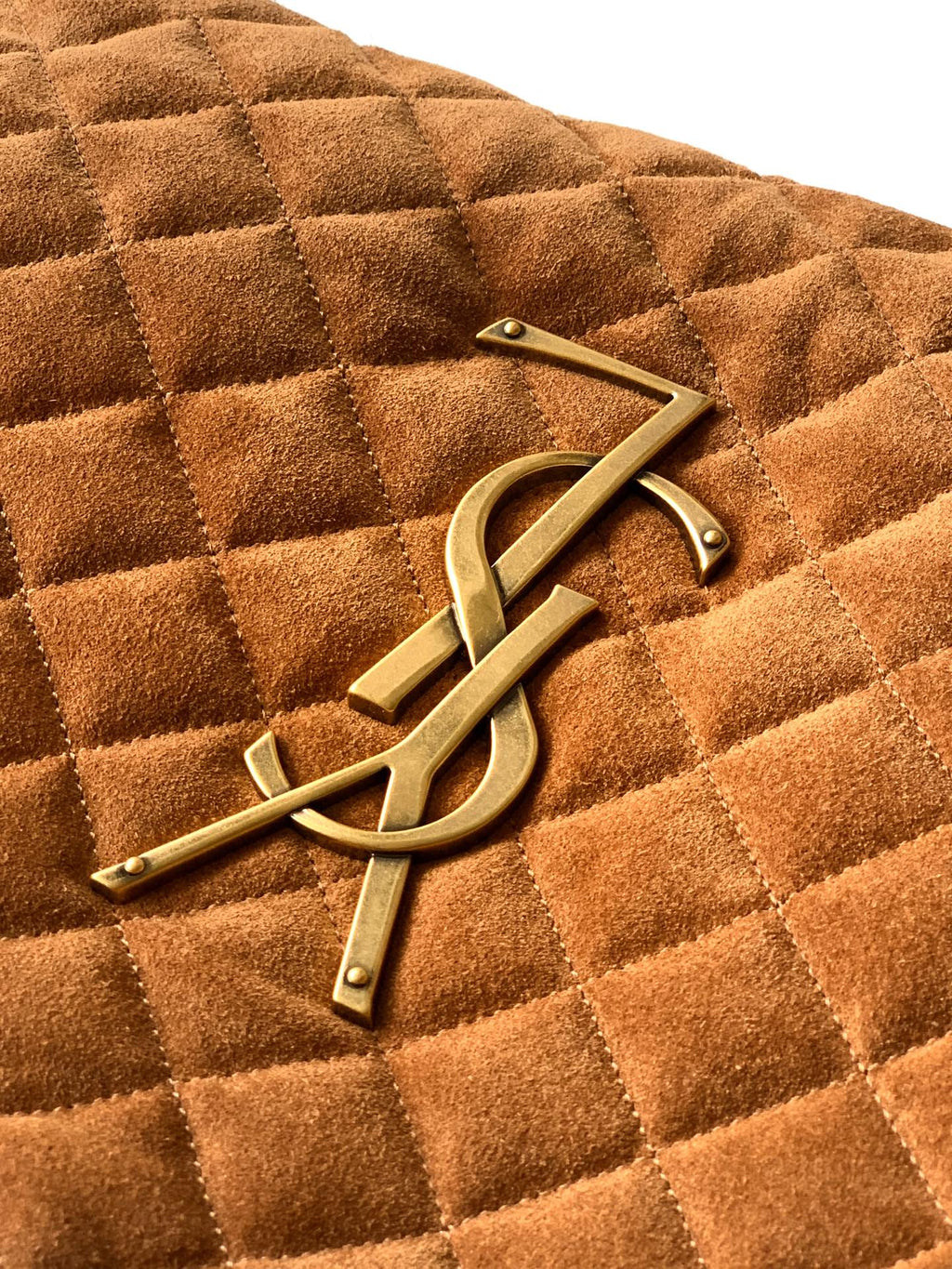 Gold YSL logo hardware on tan quilted suede handbag front