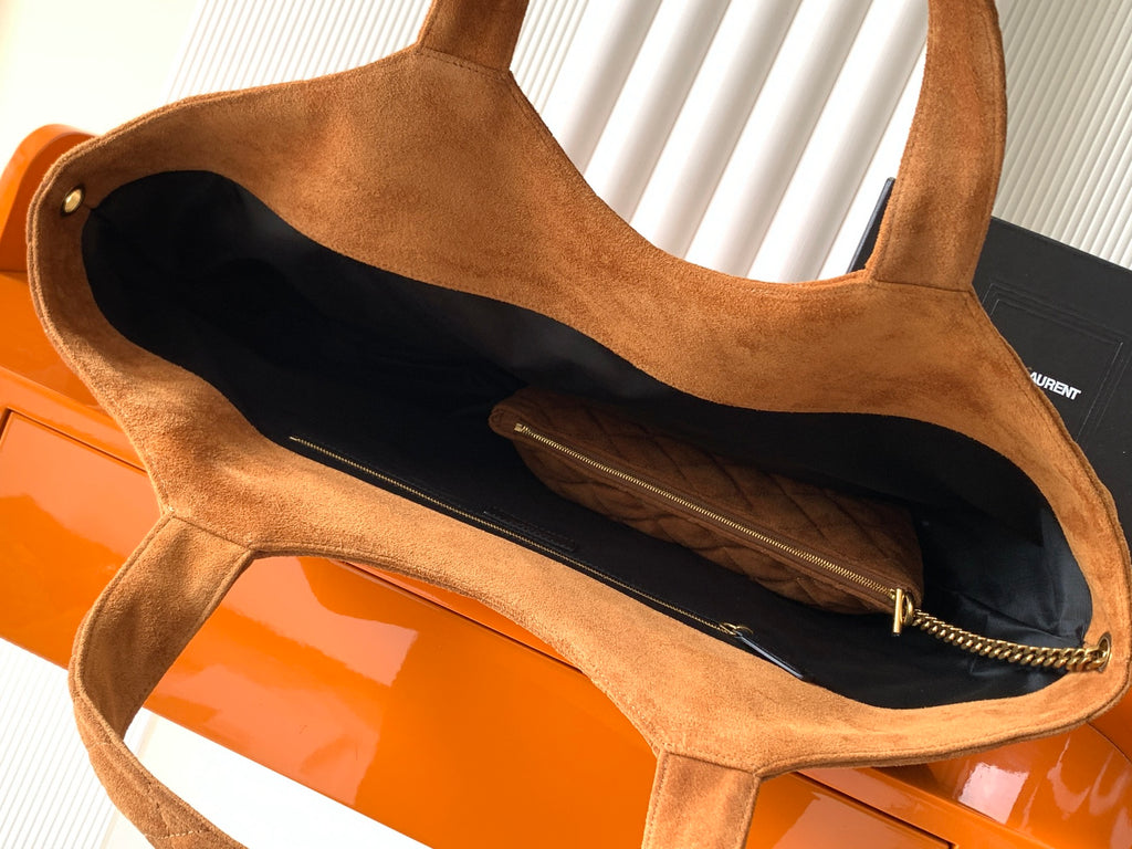 YSL tote bag open view showing dark interior lining and tan suede handles