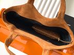 YSL tote bag open view showing dark interior lining and tan suede handles