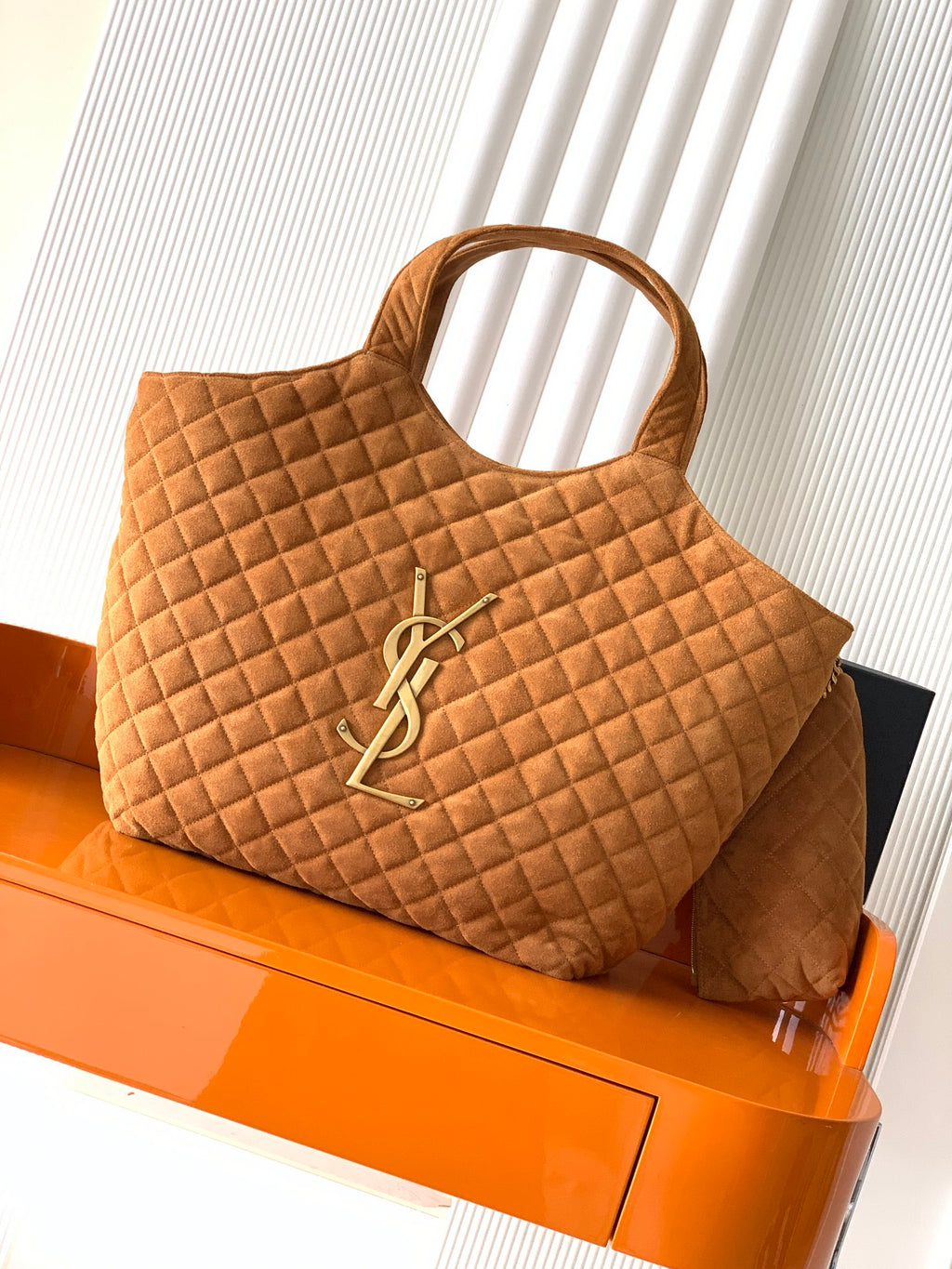 YSL quilted tote bag in tan suede with top handles and YSL metal logo front
