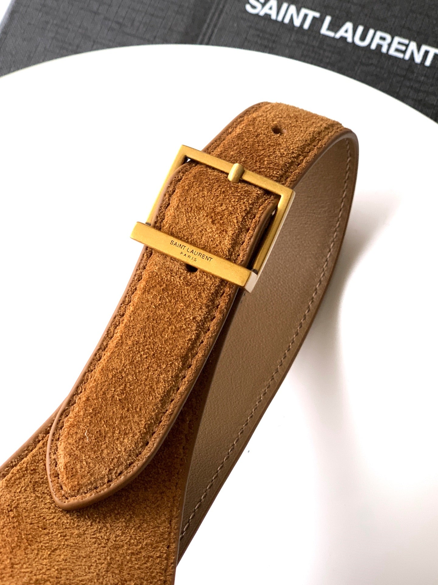 Tan suede strap with beige leather buckle and gold-tone hardware