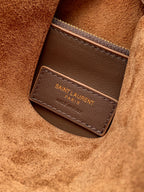 Tan suede interior pocket with brown leather label and SAINT LAURENT branding