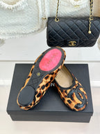 Leopard-print flats with black sole; one shows underside and pink insole lining.