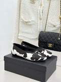 Chanel ladies flats, black/white cow print with metal ring detail