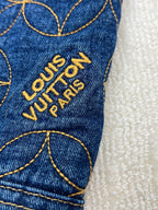 Denim jacket sleeve with embroidered Louis Vuitton Paris logo text