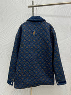 Denim jacket back with blue and gold lattice embroidery, hooded collar, button details