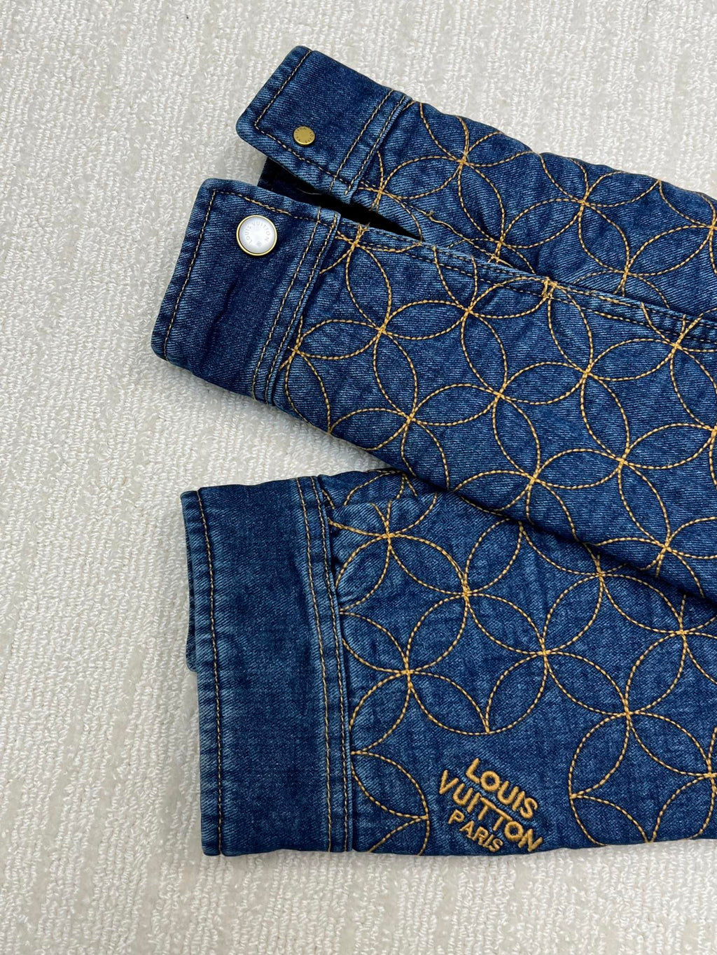 Dark blue denim pants with gold circular chain embroidery