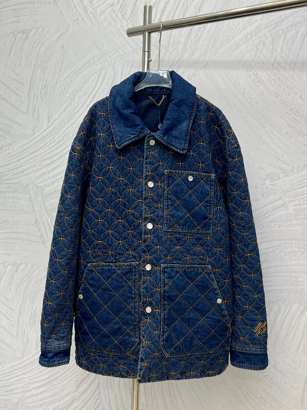 Denim jacket with blue and gold lattice embroidery, button front, long sleeves