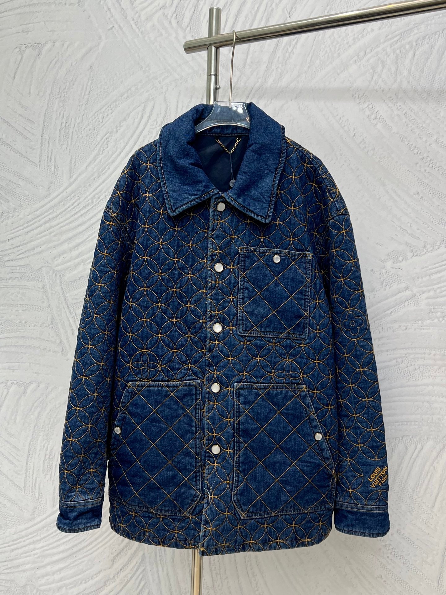 Denim jacket with blue and gold lattice embroidery, button front, long sleeves