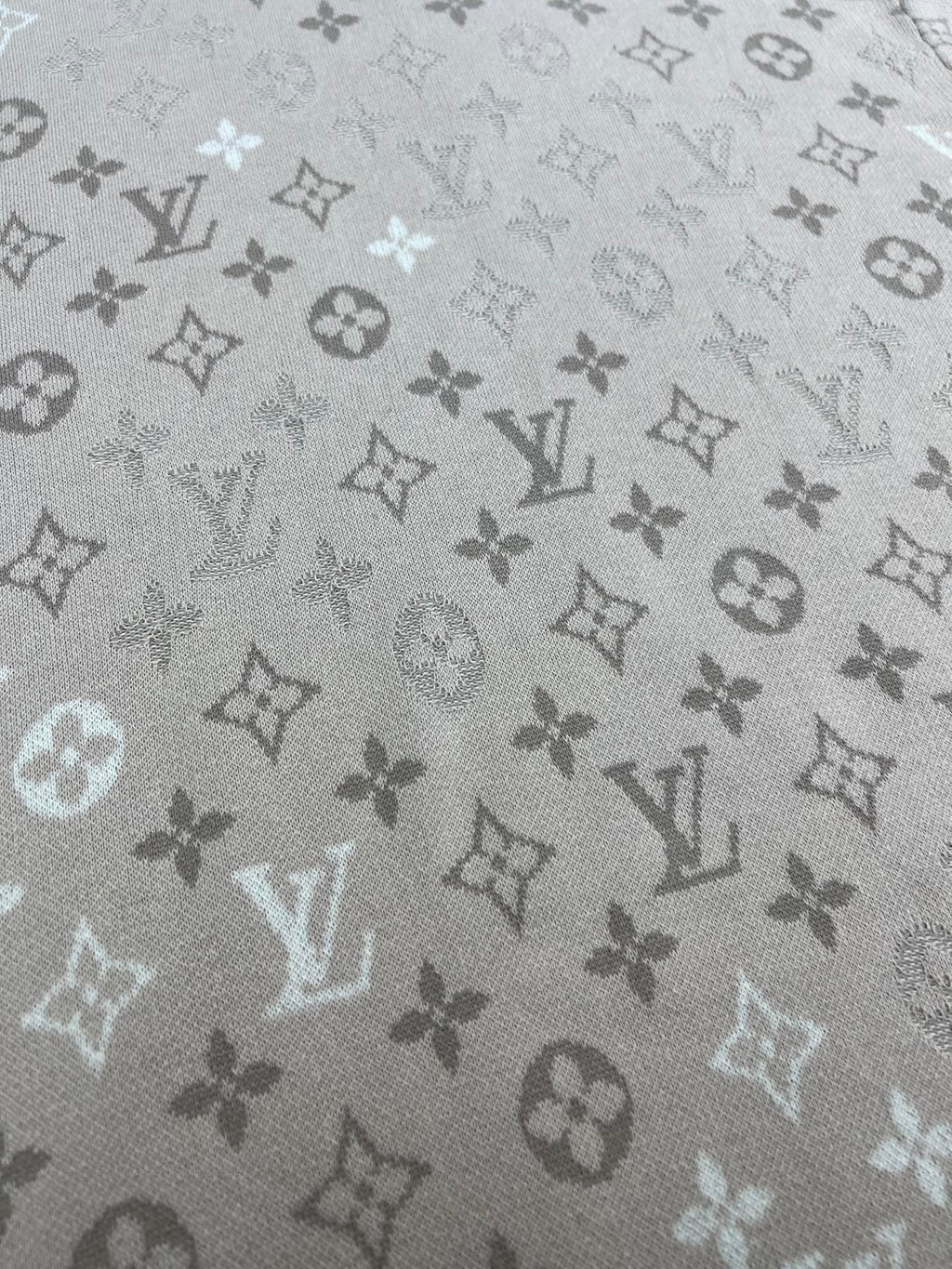 Louis Vuitton monogram T-shirt fabric close-up, light beige all-over icons