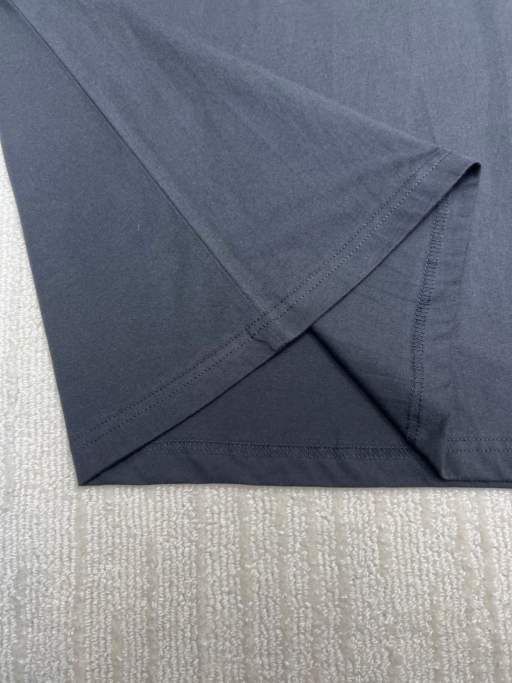 Dior T-shirt, dark; folded hem with visible stitching, sleeve end