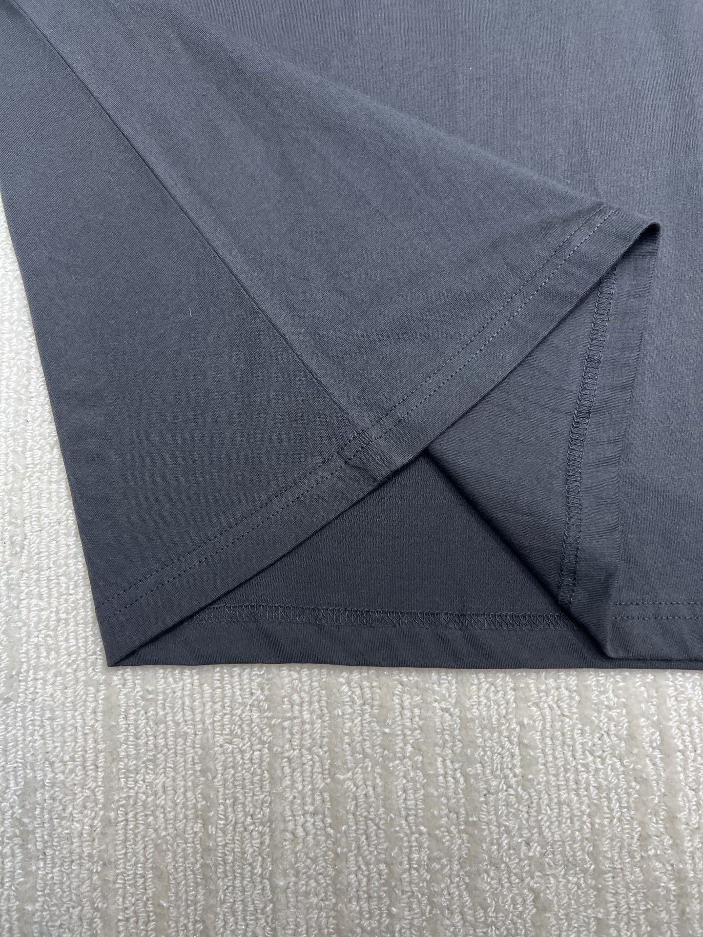 Dior T-shirt, dark; folded hem with visible stitching, sleeve end