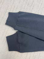 Dior hoodie sleeve cuffs and hem in dark navy knit fabric, folded view