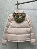 Back view long puffer jacket in light pink with plaid-lined hood.