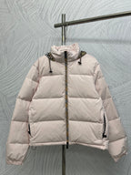 Long puffer jacket with front zip, light pink color and padded hood.