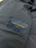 Dark fabric Louis Vuitton label patch on jacket lining, close-up