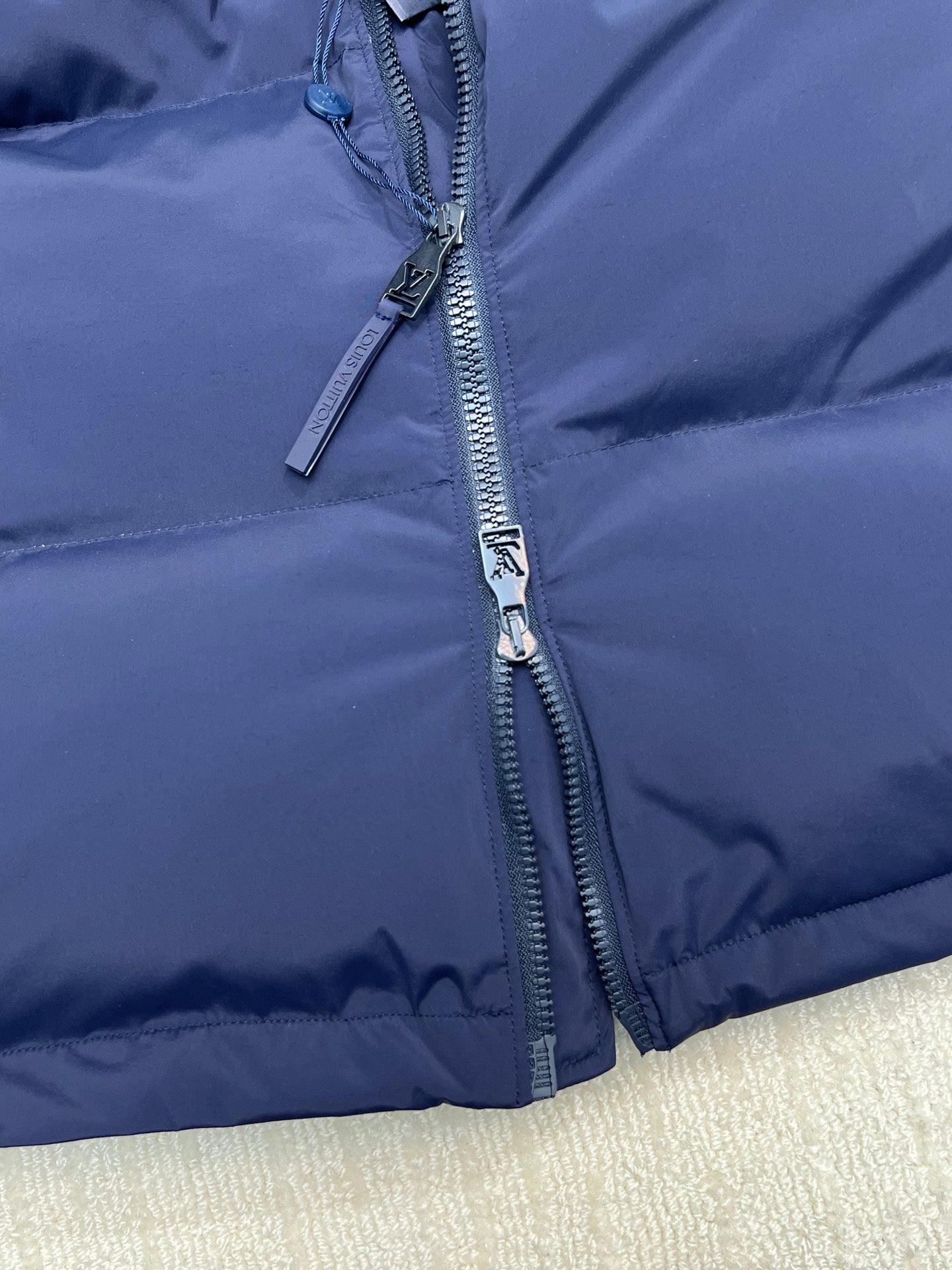 Long padded jacket, navy, front zip with logo zipper pull