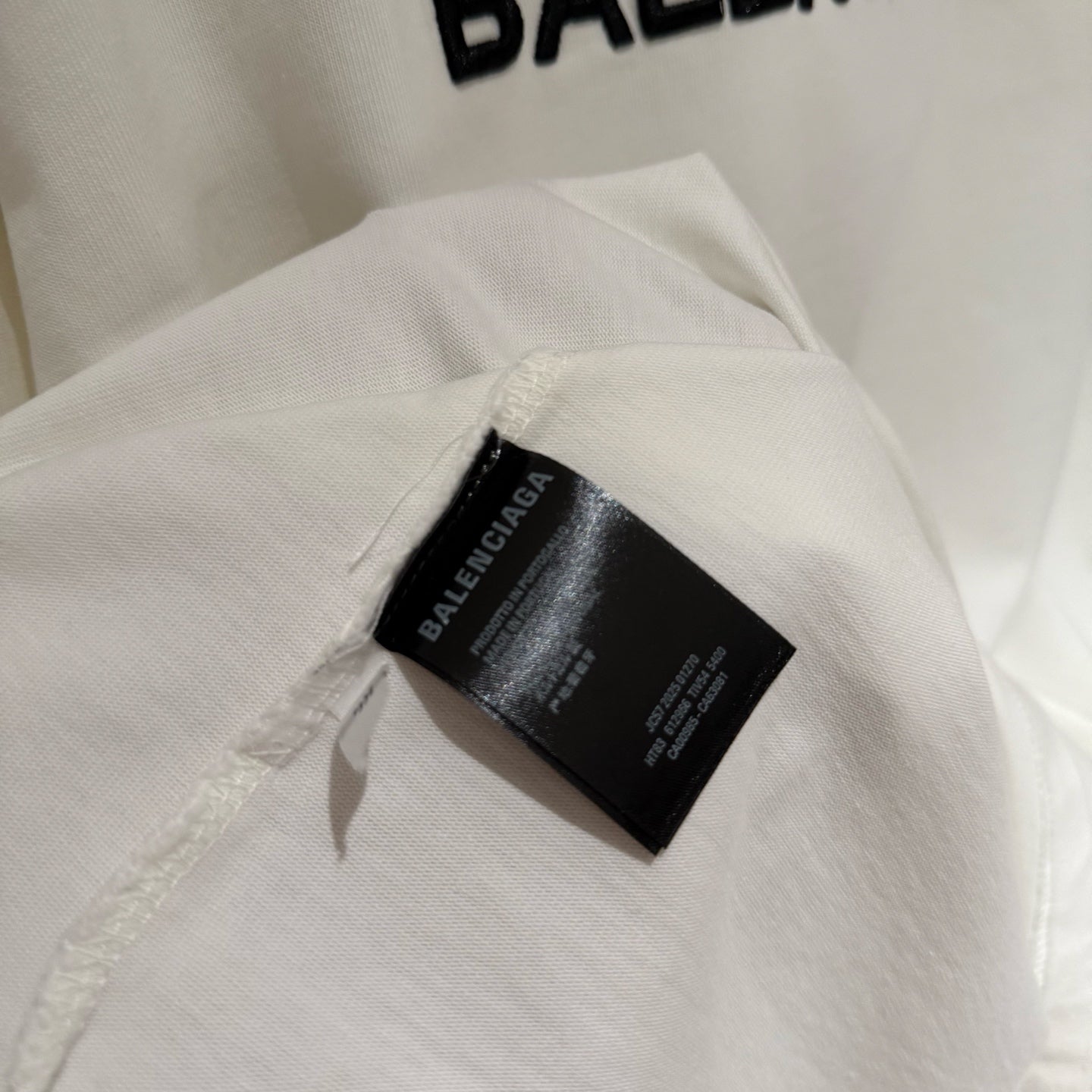 Balenciaga white T-shirt collar tag with black brand label detail