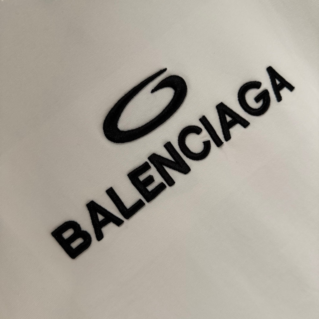Balenciaga white T-shirt close-up showing BALENCIAGA logo text