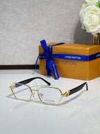 Gold-rim eyeglasses with clear lenses and gold-tone bridge hardware