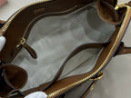 MiuMiu handbag interior with light fabric lining and gold zipper trim