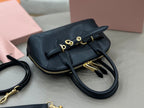 MiuMiu mini bag, black with bow front clasp, zipper closure, and gold chain