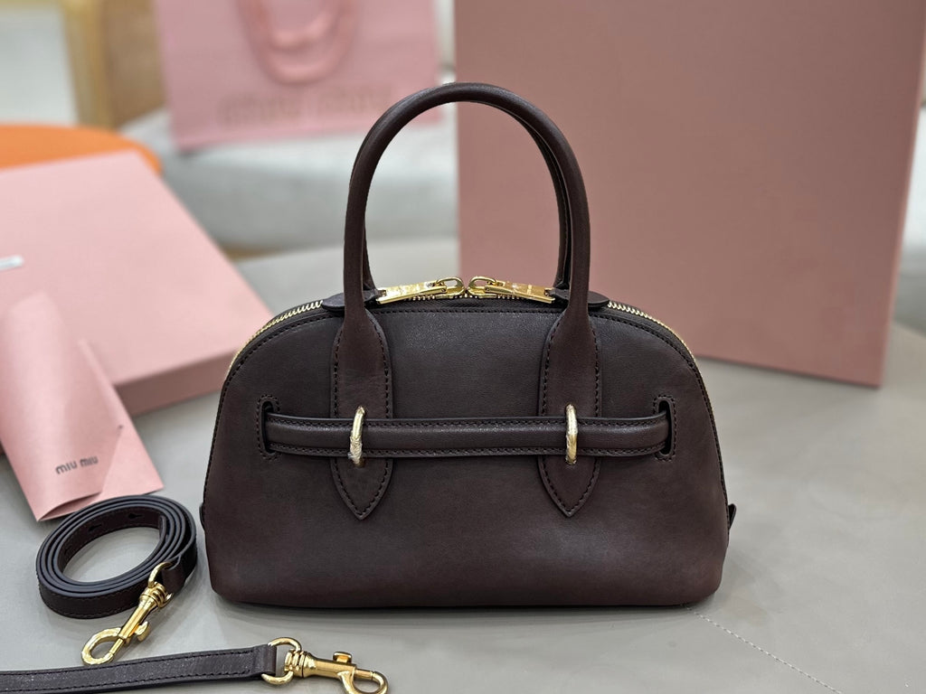 MiuMiu handbag with top handles, front belt detail, and gold-tone hardware, dark brown