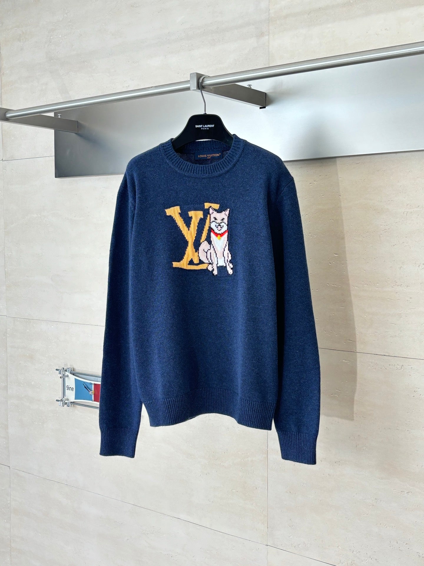 Navy knit sweater with large LV-style cat intarsia graphic at chest