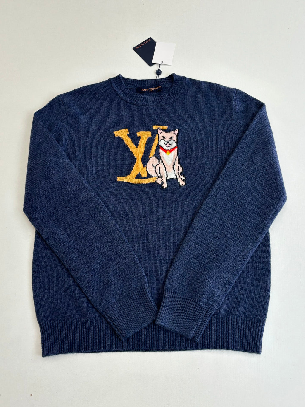 Navy knit crewneck sweater with long sleeves and front cat graphic in yellow and white