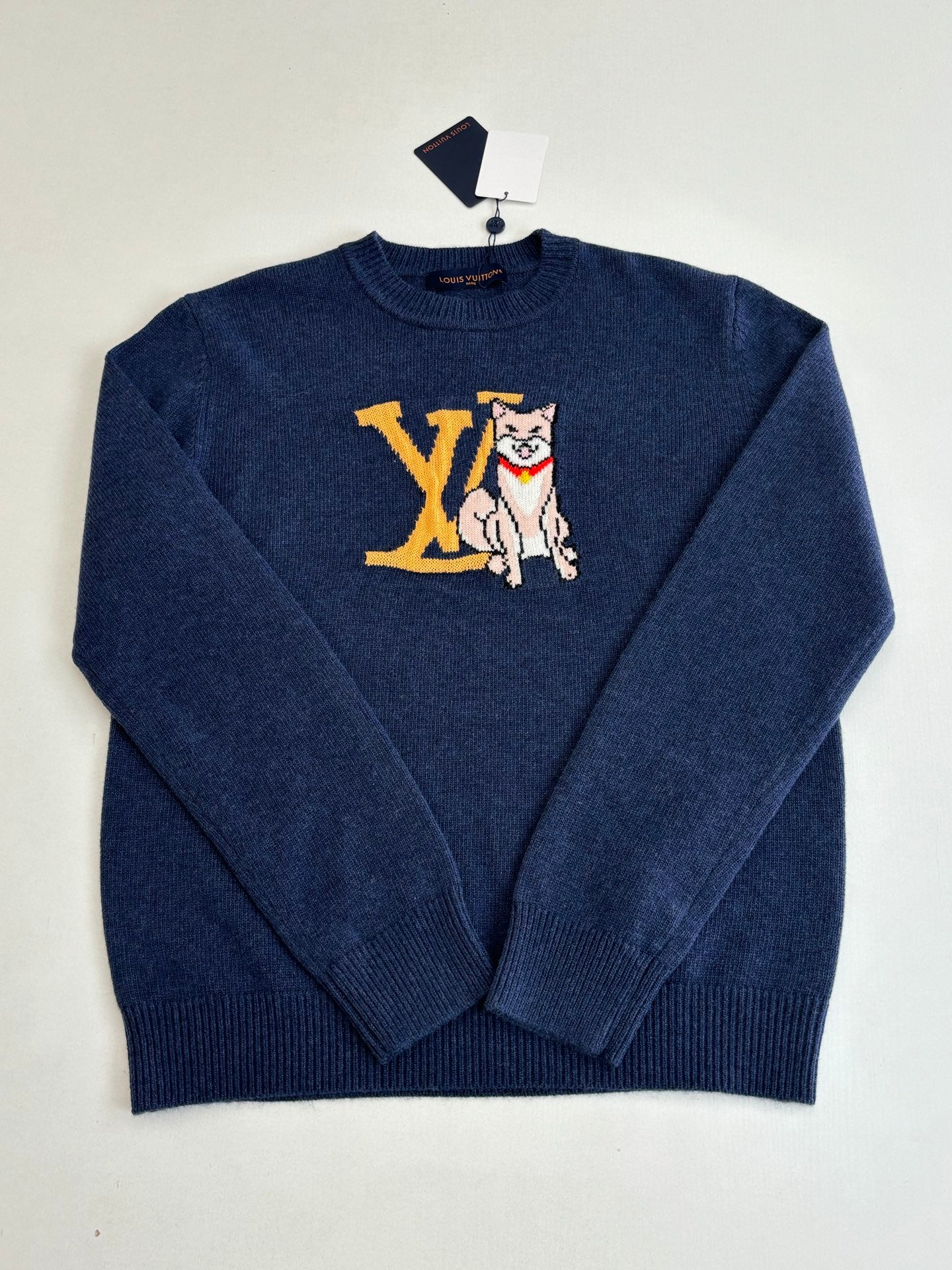 Navy knit crewneck sweater with long sleeves and front cat graphic in yellow and white