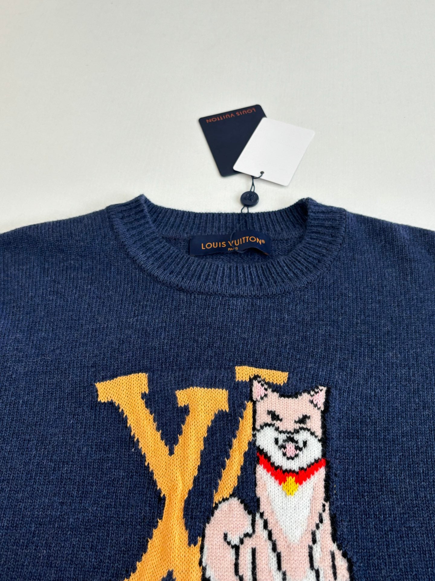 Navy Louis Vuitton crewneck sweater with cat graphic and yellow LV letters on chest