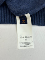 Navy sweater care label tag showing made in Italy and washing symbols