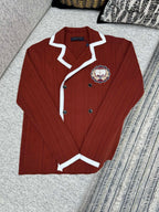 Red knit long-sleeve button cardigan with white trim and crest patch