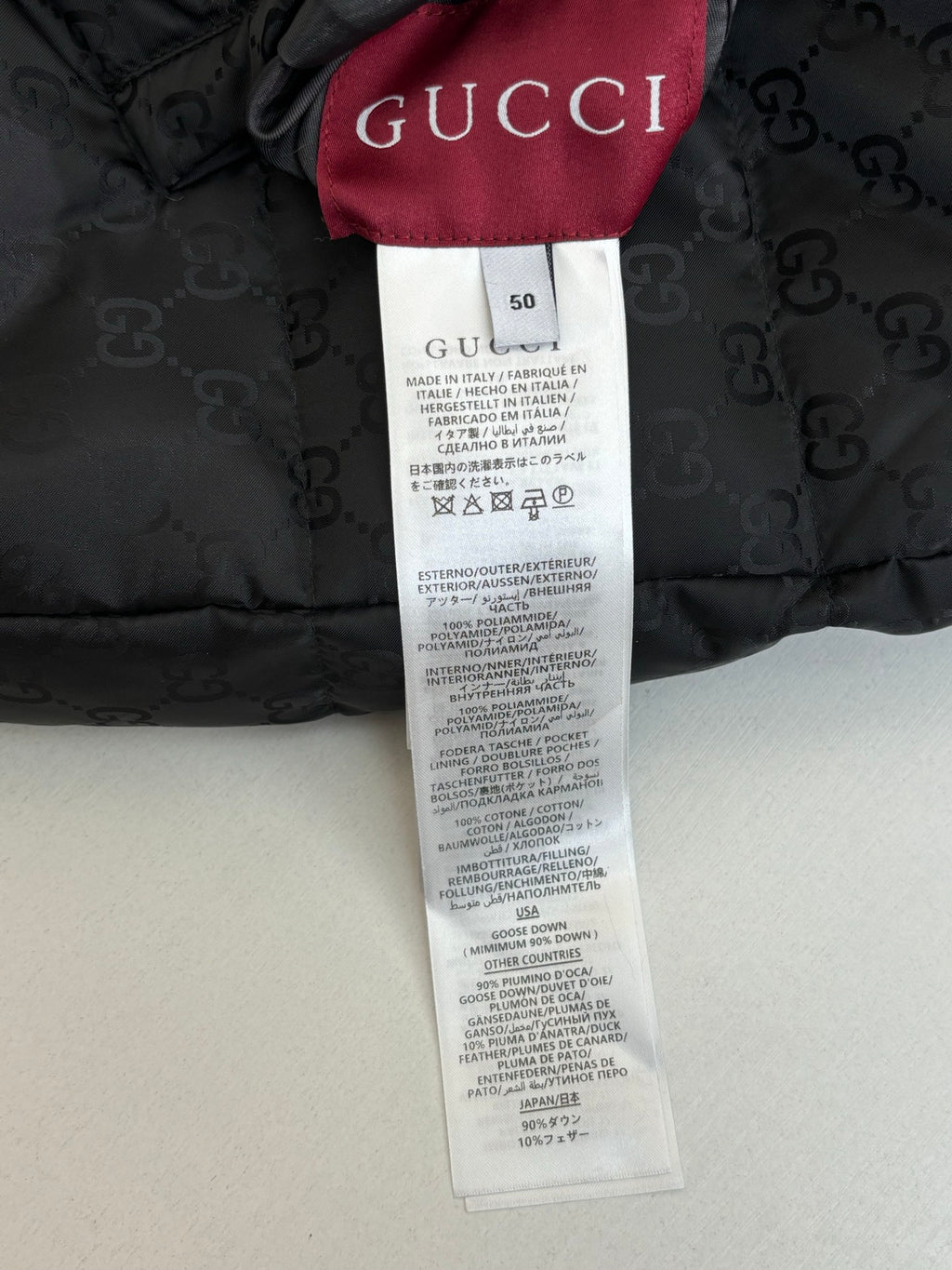 Gucci long padded jacket size tag, inner label with Gucci branding
