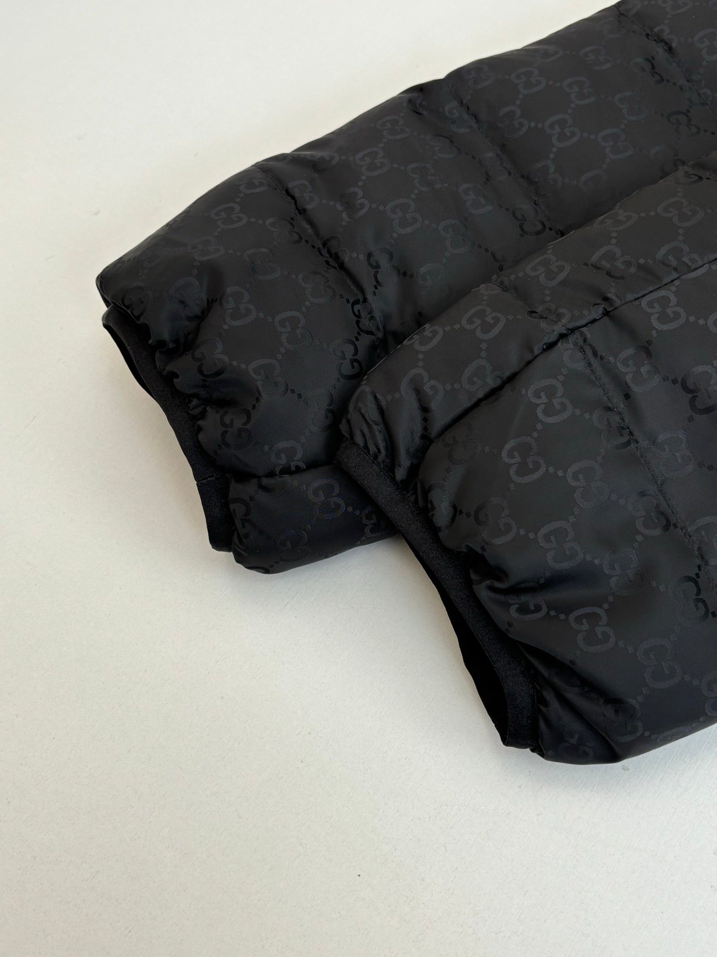 Gucci long padded jacket, black GG-pattern quilting and padded shoulders