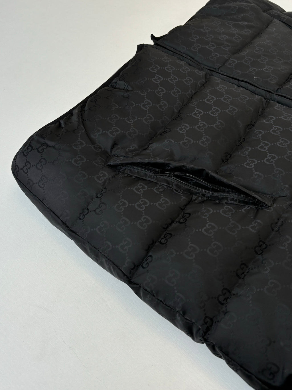 Gucci long puffer jacket in black, quilted fabric detail and zipper area