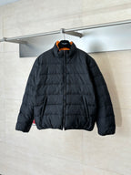 Gucci long puffer jacket in dark navy, full-zip front and stand collar