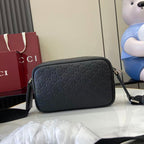 Gucci crossbody bag, dark blue embossed GG pattern, rounded shape with top zipper