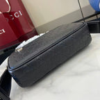 Gucci crossbody bag dark blue embossed GG pattern, long top zipper and structured sides