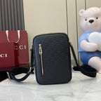Gucci crossbody bag, embossed monogram pattern, front zip and adjustable strap