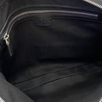 Dark navy bag interior with fabric lining and zip closure