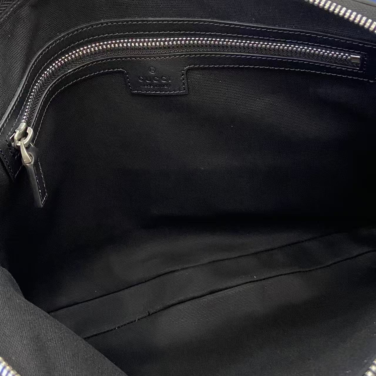 Dark navy bag interior with fabric lining and zip closure