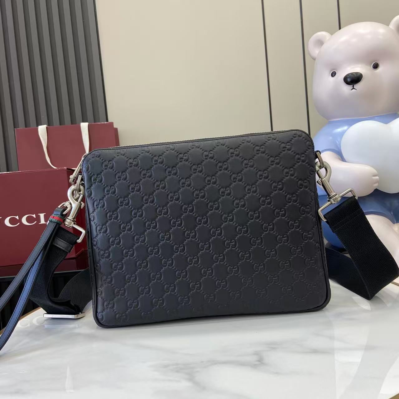 Gucci messenger bag, dark navy GG monogram leather, zip top, adjustable strap