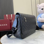 Blue embossed GG flap crossbody bag with gold-tone clasp and strap